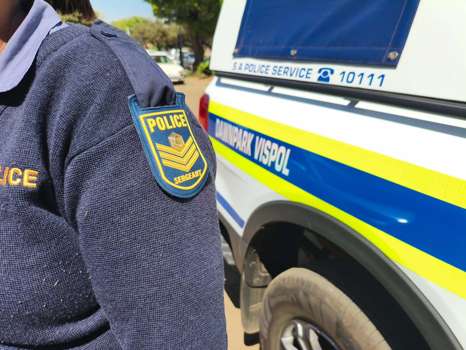 SAPS sergeant shoulder badge featured in a Dawn Park crime alert story.